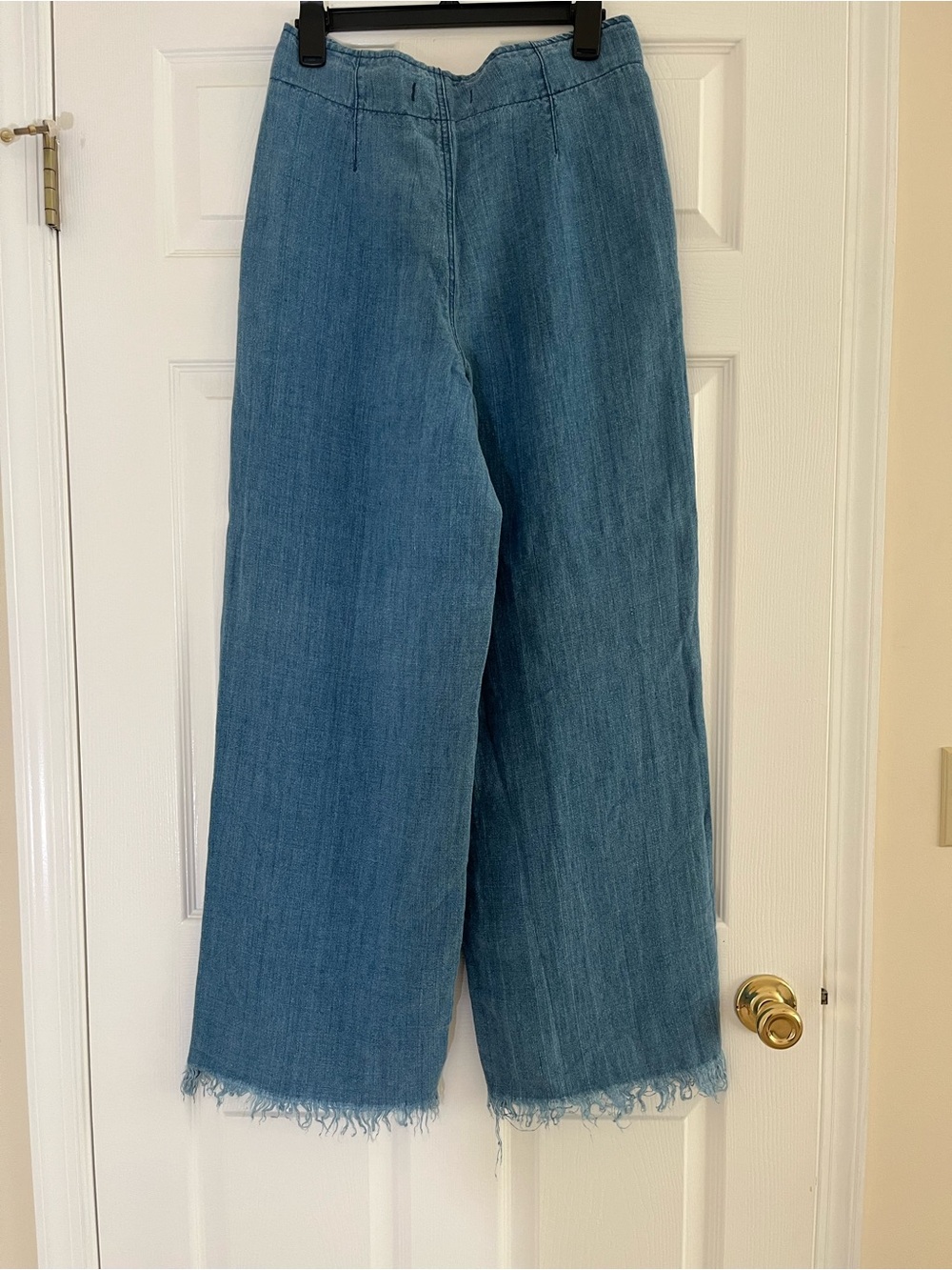 Free People High-Rise Wide Leg Jeans in Medium Blue with Raw Hem